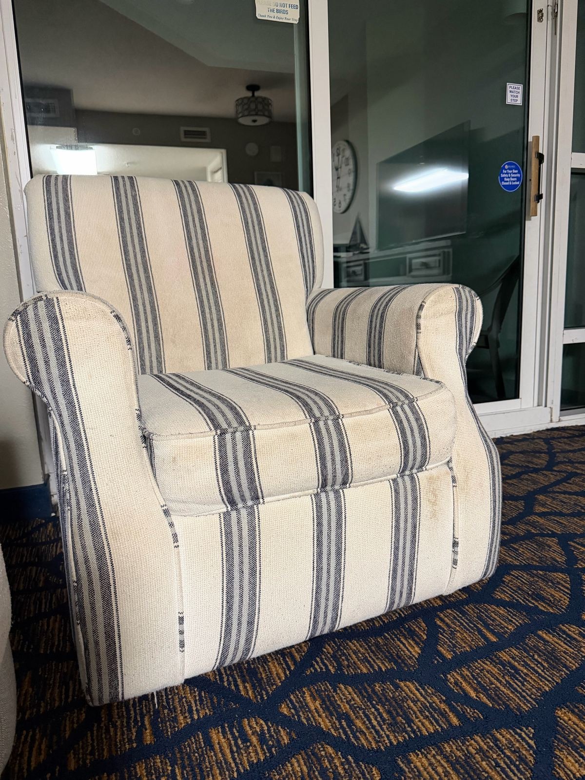 Stained striped armchair in the living area